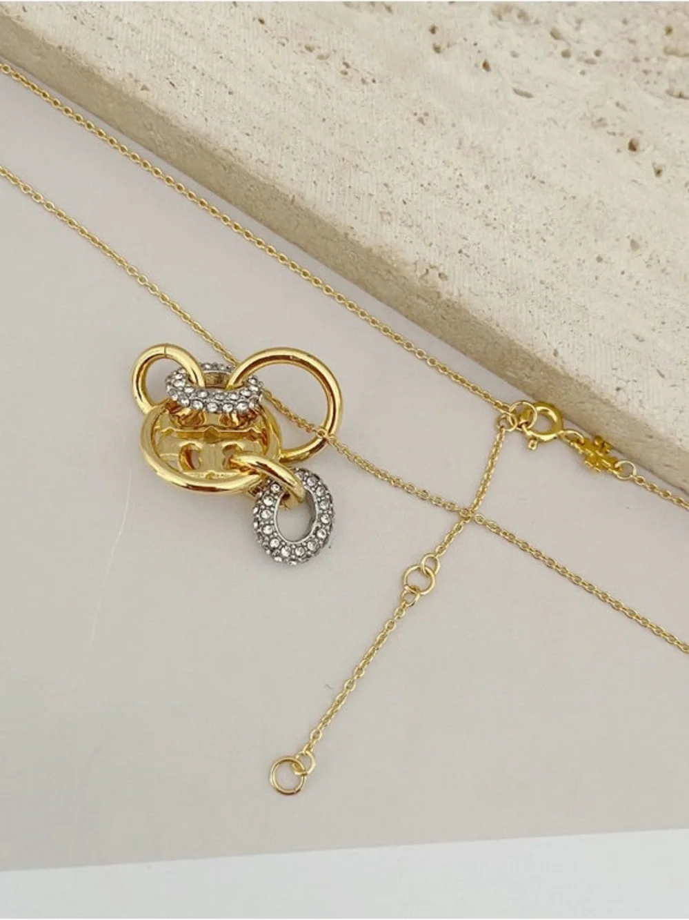 Tory Burch Gold-Tone Interlocking Circle Pendant with Crystal Accents